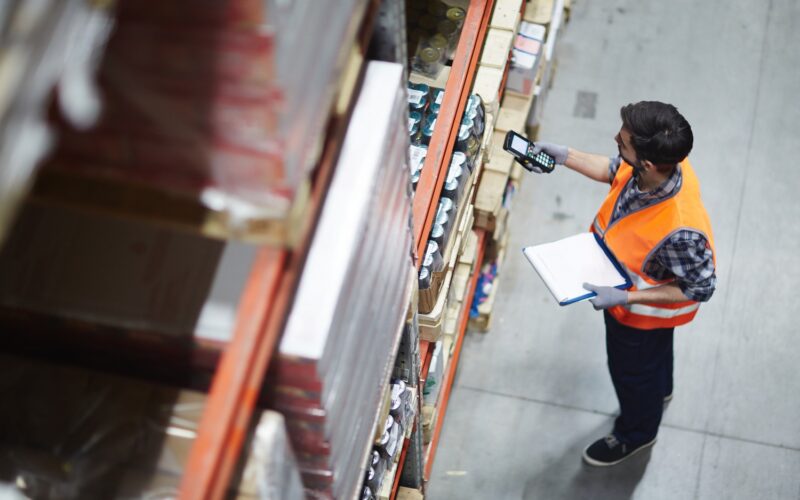 A man is working in a warehouse