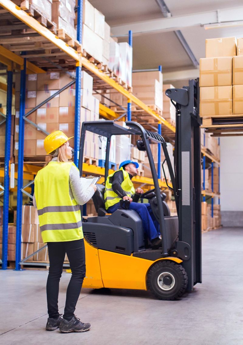 warehouse employers working in a big factory.